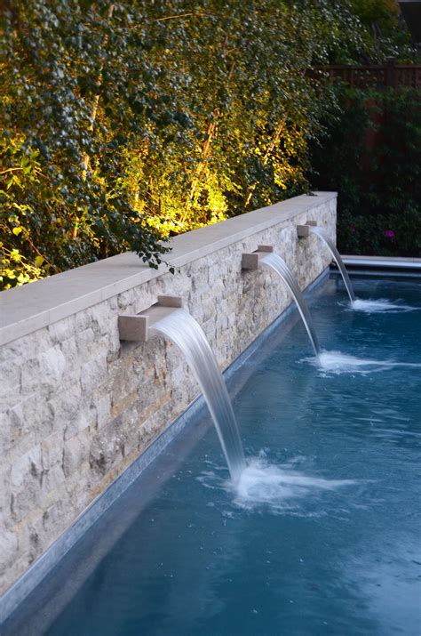 This may sound a bit weird, but why not have a swimming pool in the living room? Stone Wall & Pool Water Feature | Water feature wall ...