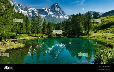 The Blue Lake And The Matterhorn In A Scenic Summer Landscape With