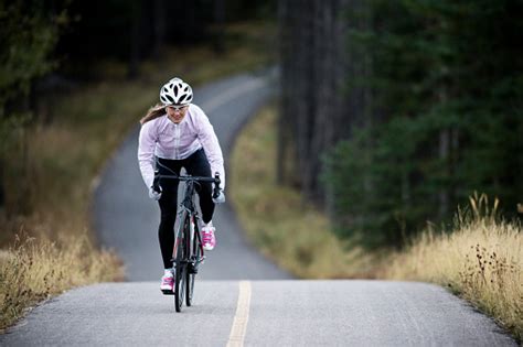 A Woman Rides Her Road Bike Along The Trans Canada Trail Bikepath Near