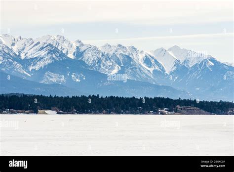 Frozen Windermere Lake And Rocky Mountains In British Columbia Canada