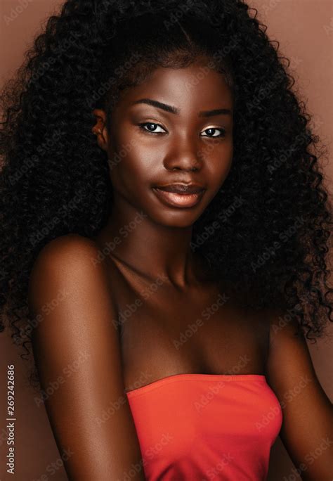 Brunette Curly Haired Young Model With Dark Skin And Perfect Smileafrican Beautiful Woman