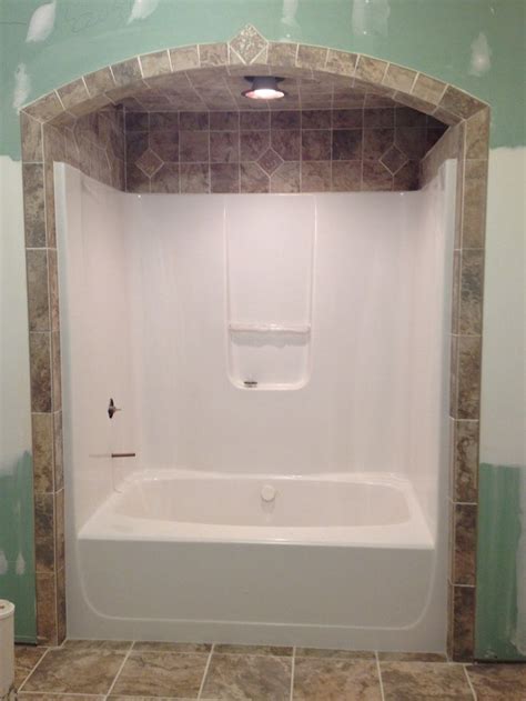 For tubs that are not freestanding, consider a tub surround with your ceramic tile choice. 53c6814ac0cada6501c97f6edde3fa90.jpg (736×981) | Tile tub ...