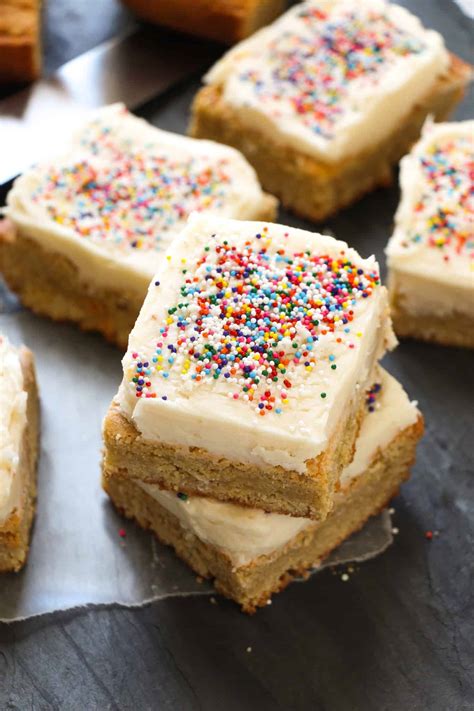 Decorating sugar cookies was a holiday tradition for my family growing up. Frosted Sugar Cookie Bars. - Layers of Happiness