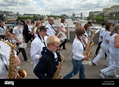 Saxophonists Cross London Bridge Playing Leviathan A Musical Work