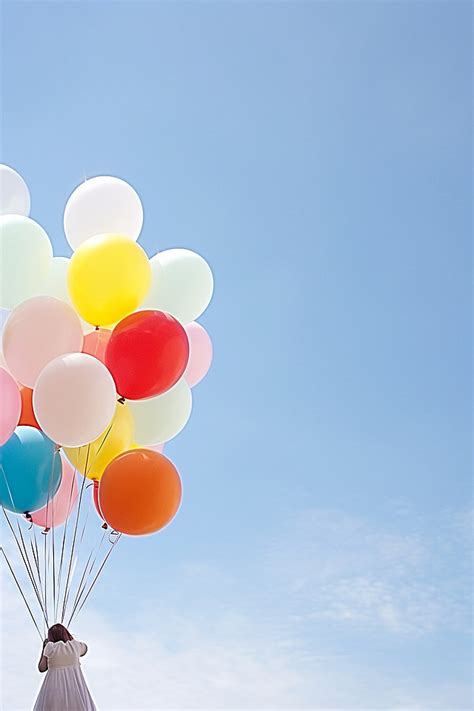 Colorful Balloons Are Flying In The Sky Against A Blue Sky Background
