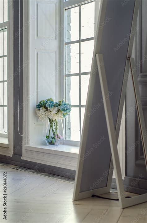 Mirror And Glorious Pastel Pink Bouquet In Glass Jug On Windowsill By