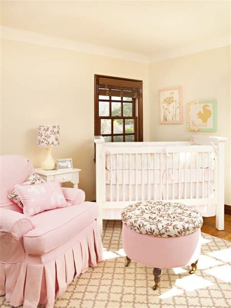 It includes a fireplace topped with red flower vases. Soft Pink and Beige Nursery | Baby Room Ideas