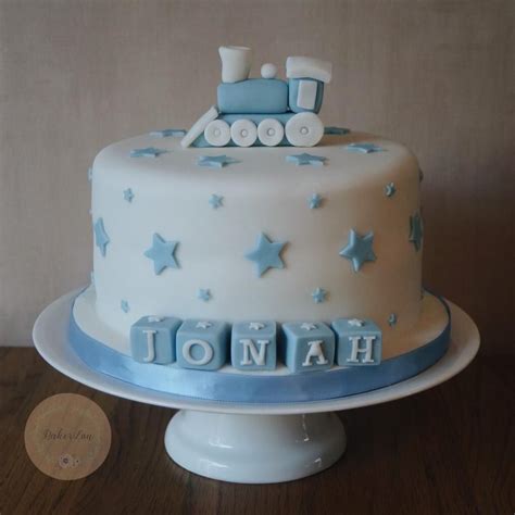 Sleeping baby baptismal cake (royal icing). Cute train cake for a baby boy's christening with blue ...