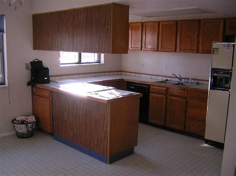 Always ensure your wall cabinets are level with a spirit level. GIY: Goth It Yourself: Repurposing Kitchen Cabinets