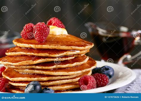 Stack Of Pancakes With Berries And Maple Syrup Stock Photo Image Of