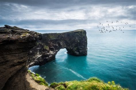 Dyrhlaey Cliffs Blue Oceans And Black Cliffs Near Vk Iceland Photo By
