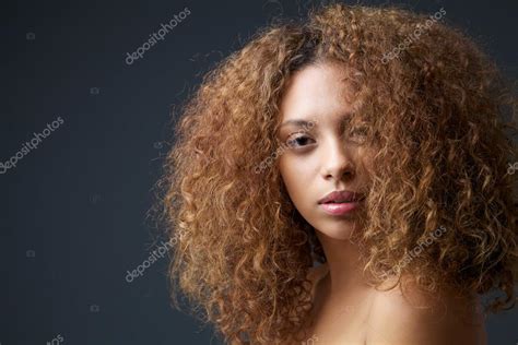 Beauty Portrait Of An Attractive Female Fashion Model With Curly Hair