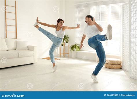 Beautiful Young Couple Dancing In Living Room Stock Photo Image Of