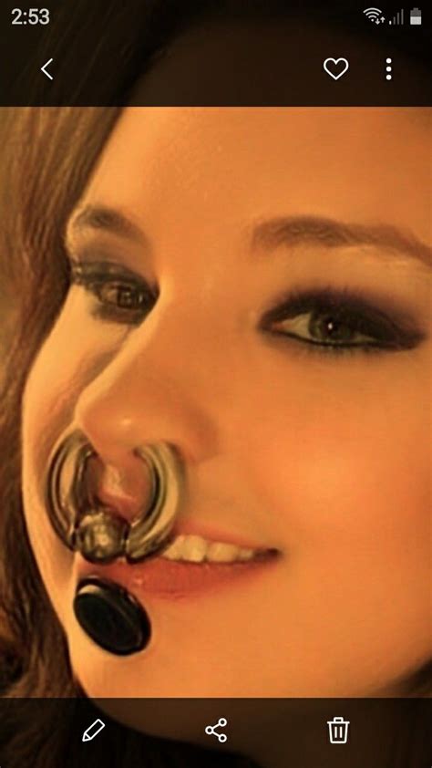 a woman with a nose ring attached to her nose