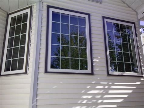 Window grids, also known as window grilles, are a popular window option to give the appearance of individual panes of glass. white vinyl window, white grilles, windswept smoke ...