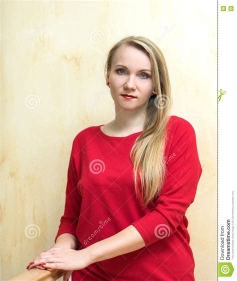 Beautiful Woman In A Red Dress Against The Wall Stock Image Image Of