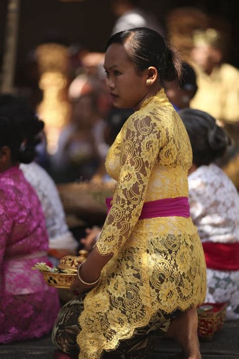 a balinese woman in traditional clothes on hindu temple ceremony bali island indonesia