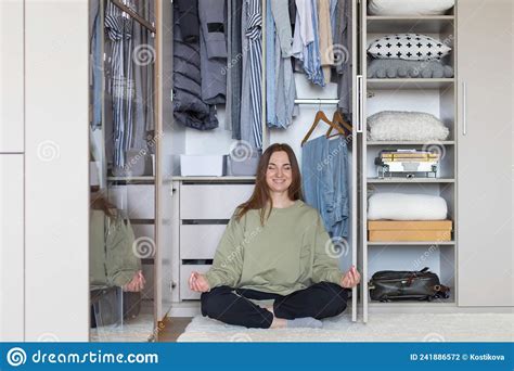 Cheerful Female In Lotus Position At Modern Wardrobe Storage Happy Housewife Posing Meditating
