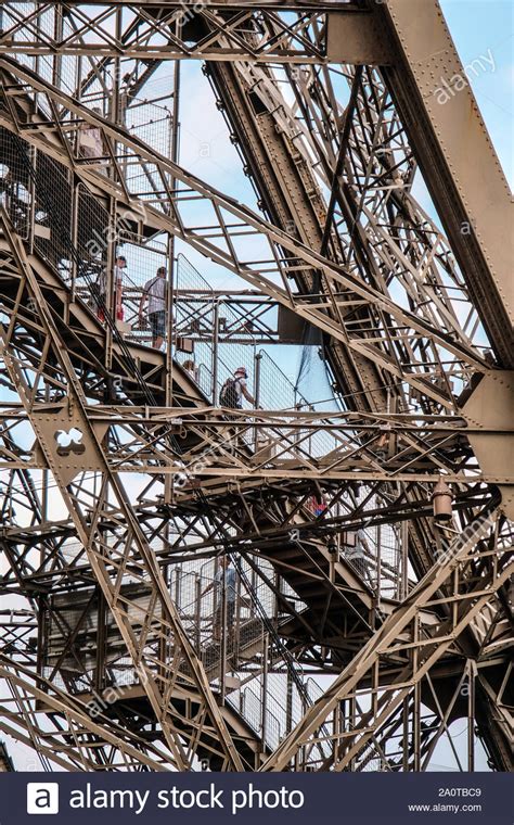 Tourists Walking Down Stairs Inside Wrong Iron Frames Of Eiffel Tower
