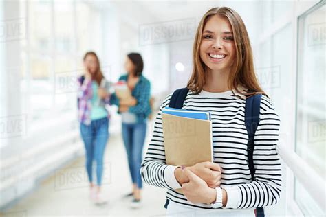 Portrait Of Beautiful Smiing Female College Student Stock Photo