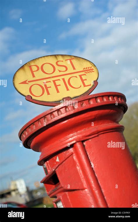 Traditional English Red Pillar Box With A Rare Post Office Sign On Top