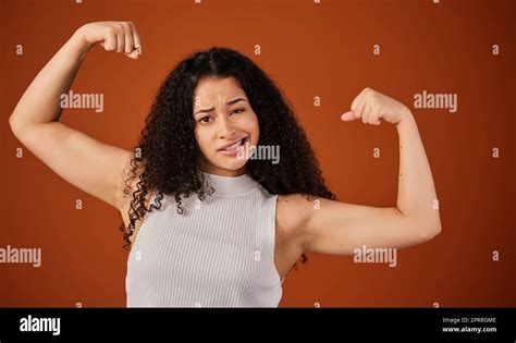 Im Crazy Strong Cropped Portrait Of An Attractive Young Woman Flexing