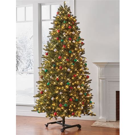 The Remote Controlled Height Adjustable Christmas Tree Hammacher