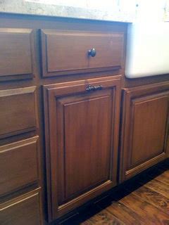 These are some of the best quality storage. Knob placement on trash pull out cabinet