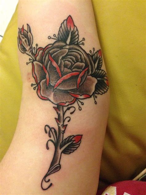 So this design can help you cut. Black & grey with red rose tattoo done at Kreepy Tiki ...