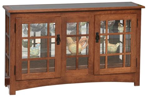 Great for creating customized displays, the lower shelf has a groove designed to hold plates and the adjustable glass shelf has two height options. Mission Style Large Console Curio Cabinet from ...