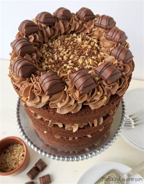 A Three Layer Chocolate And Hazelnut Sponge Sandwiched And Topped With