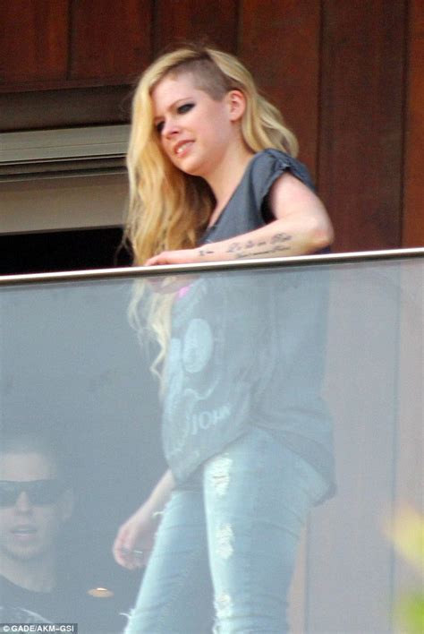 Avril Lavigne Lands In Rio For A Concert And Some Coconut Juice At The