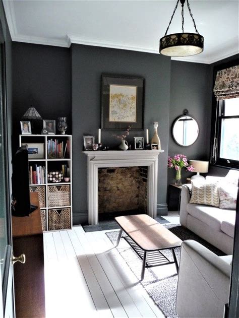 With this living room, the grey colour scheme is utilized to keep an almost cluttered room for looking messy and overstuffed. Snug TV room. Dark grey walls. See blog for details. White painted floor boards. | Living room ...