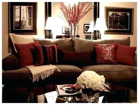 Contemporary living room in other with grey walls, medium hardwood flooring, a standard fireplace, a metal fireplace surround and brown floors. red and gold living room decor red gold and brown living ...