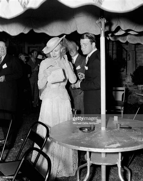 Actress Ginger Rogers With Husband Actor Lew Ayres During A Party In