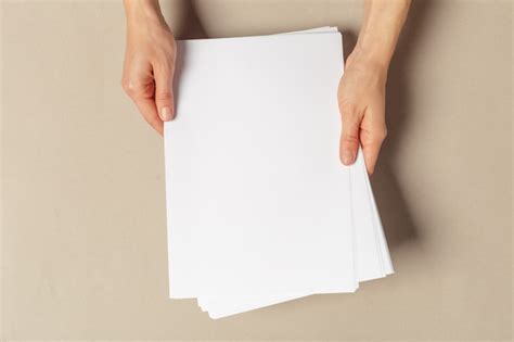 Premium Photo Hand Holding Papers A4 Size
