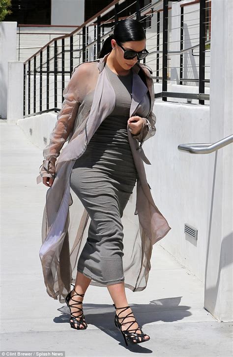 Sister Act Kim Kardashian Shows Off Pregnancy Curves In Clingy Grey Tube Dress As Sibling Khloe
