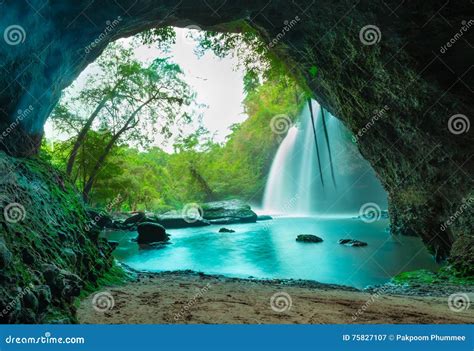 Amazing Cave In Deep Forest With Beautiful Waterfalls Background Stock