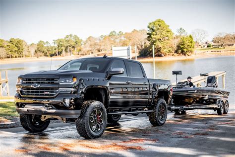 Sca Chevy Black Widow Jacked Up Trucks Chevy Trucks Silverado Trucks