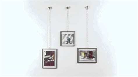 Può essere utilizzato sia in verticale che in orizzontale. UMBRA FOTOCHAIN 3 CORNICI OTTONE PORTA FOTO DA PARETE MURO ...