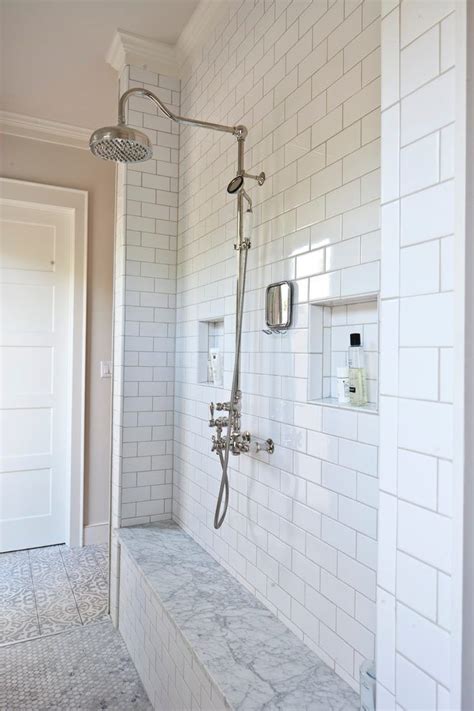 If i were to tile the back wall of a shower or bathtub surround with subway tile i would generally start with a vertical centerline. subway tile niche bathroom farmhouse with shower bench ...