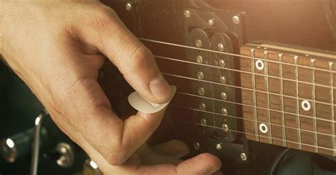 How To Hold A Guitar Pick Properly A Guide For Beginners Sharpens
