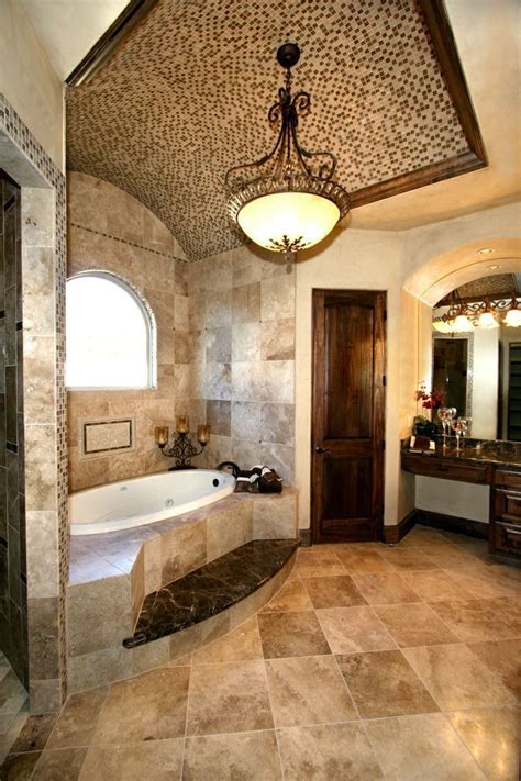 Tuscan bathroom design is a style that is reminiscent of one of the most historic regions of the world. Luxury bathroom in Tuscan style with a bathtub and beige ...