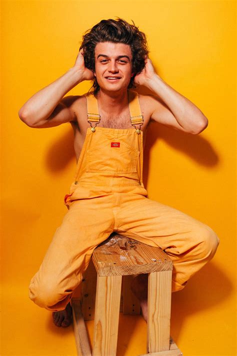 Download Joe Keery In Yellow Jumper Wallpaper | Wallpapers.com