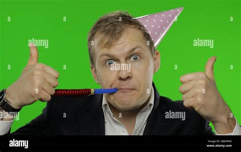 Portrait Of Drunk Sleepy Young Clerk Man With A Hangover Blowing A Whistle Giving Thumbs Up