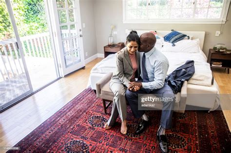 Mature Mixed Race Couple Getting Ready For Work High Res Stock Photo