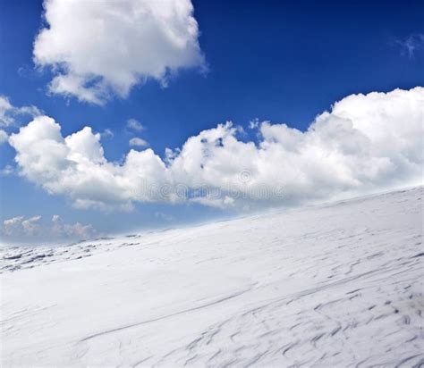 Winter Landscape With Snow Covered Hill And Blue Sky Stock Image