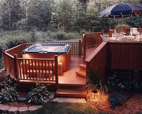 A Hot Tub Sitting On Top Of A Wooden Deck