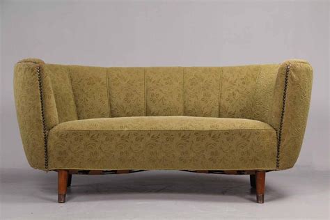 There are hundreds to choose from; Danish furniture manufacturer. Banana-shaped sofa upholstered with greenish brocade fabric ...