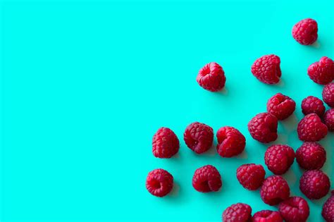 Raspberries With Blue Background Space For Text Free Stock Photo Picjumbo